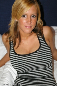 Blonde amateur poses on bed