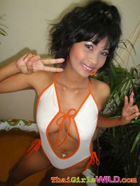 Thai GF posing and getting naked