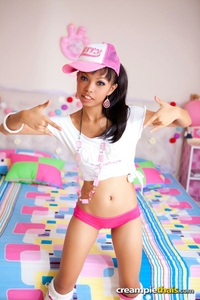 Slender Thai cutie posing and stripping