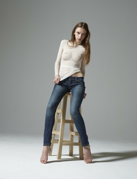 Aya Beshen pulls down jeans