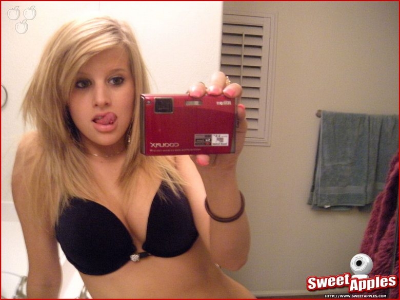 Alisa poses before a mirror