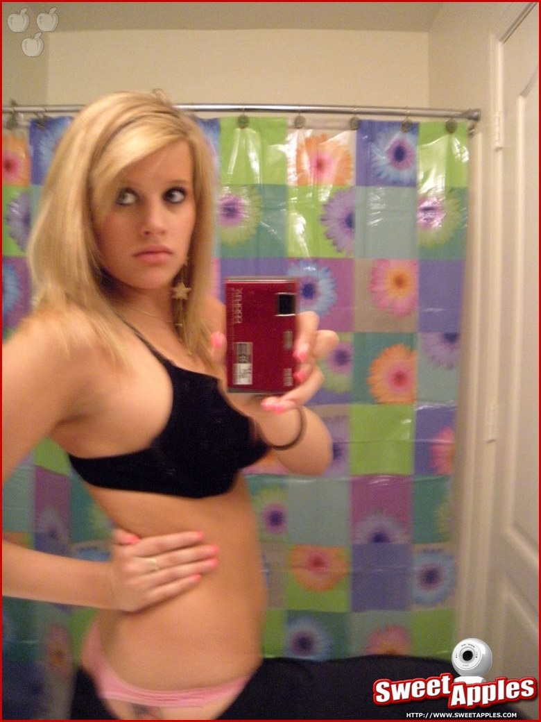 Alisa poses before a mirror