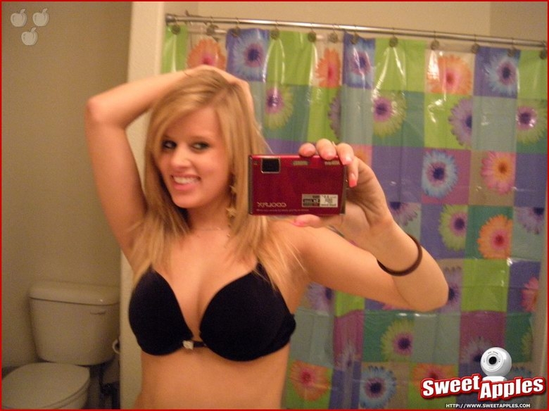 Alisa poses before a mirror