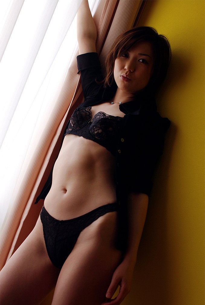 Sexy Japanese teen poses in the window