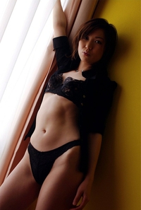 Sexy Japanese teen poses in the window