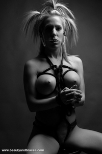 Fetish babe in headgear and braces