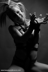 Fetish babe in headgear and braces