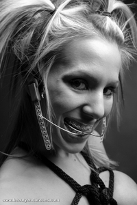 Fetish babe in headgear and braces