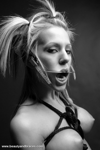 Fetish babe in headgear and braces