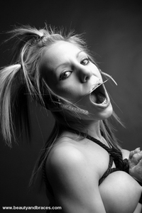 Fetish babe in headgear and braces