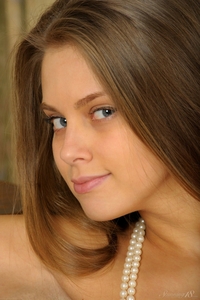 Young Kristel bends over