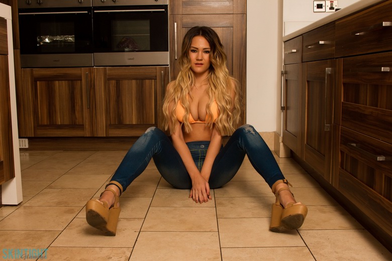 Daisy Rose pulls down jeans