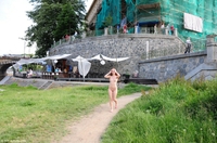 Denisa walking naked at the riverside