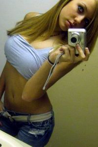 Amater girl takes selfshots in bathroom